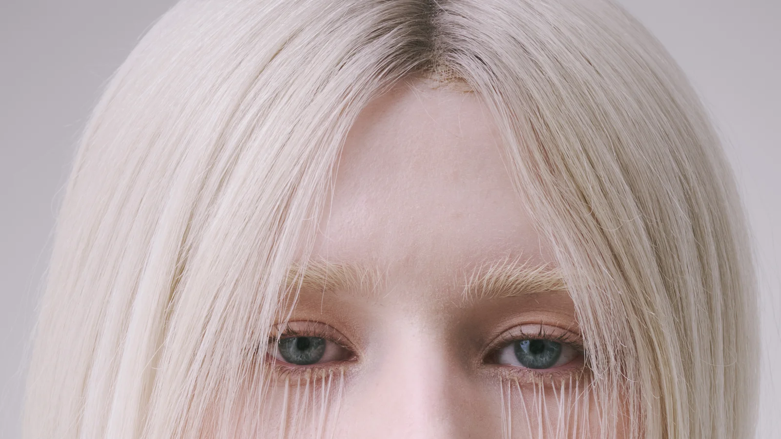 Dry hair and flyaways cleaned, skin, brows and lashes refined, lace net still visible at the parting