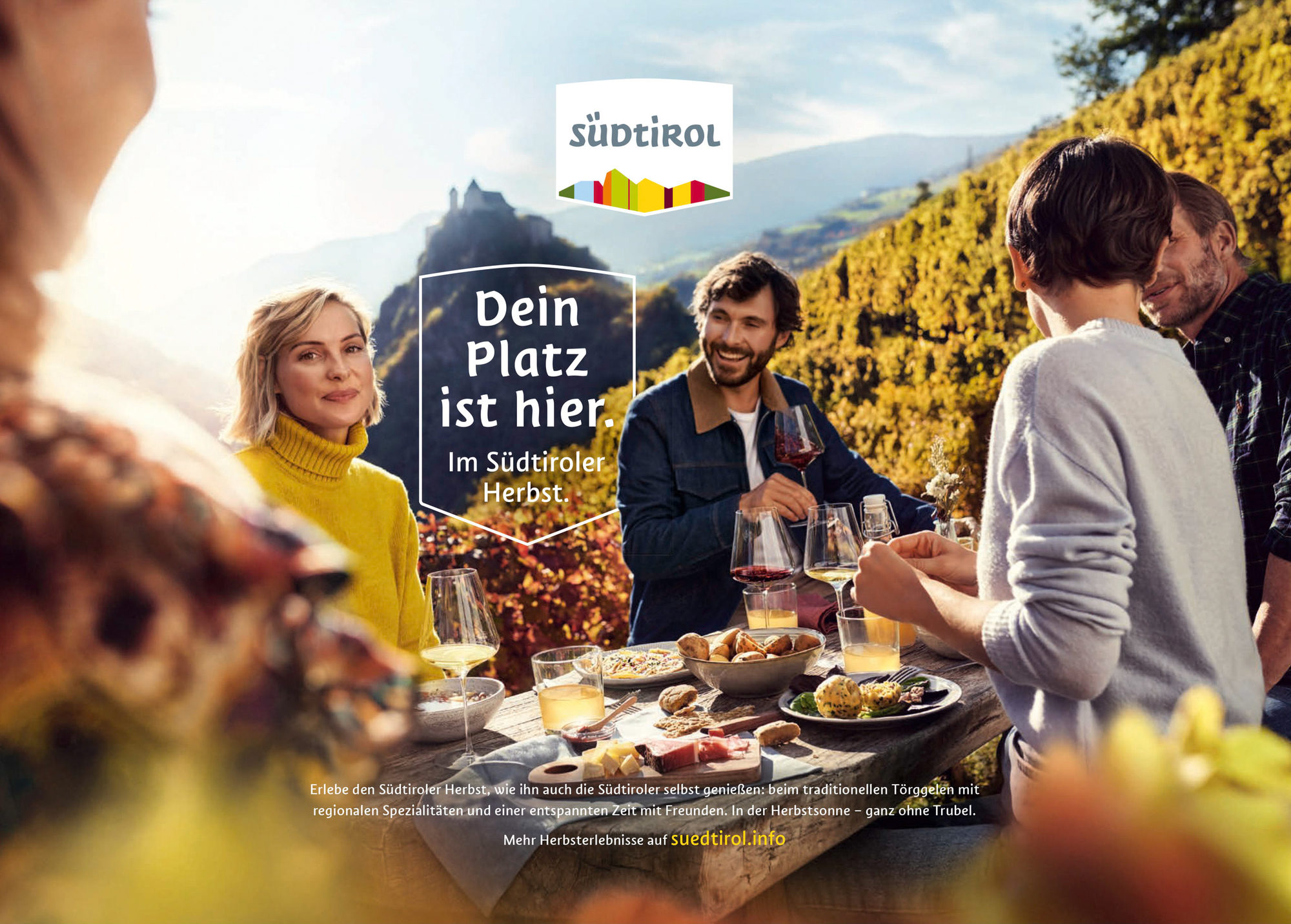 Group of people enjoying South Tyrolean food outdoors in the mountains
