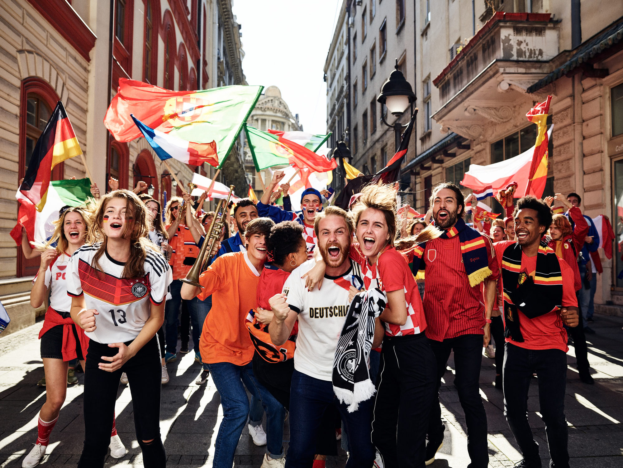 Football fans celebrating together in the street for ZDF UEFA Euro 2020