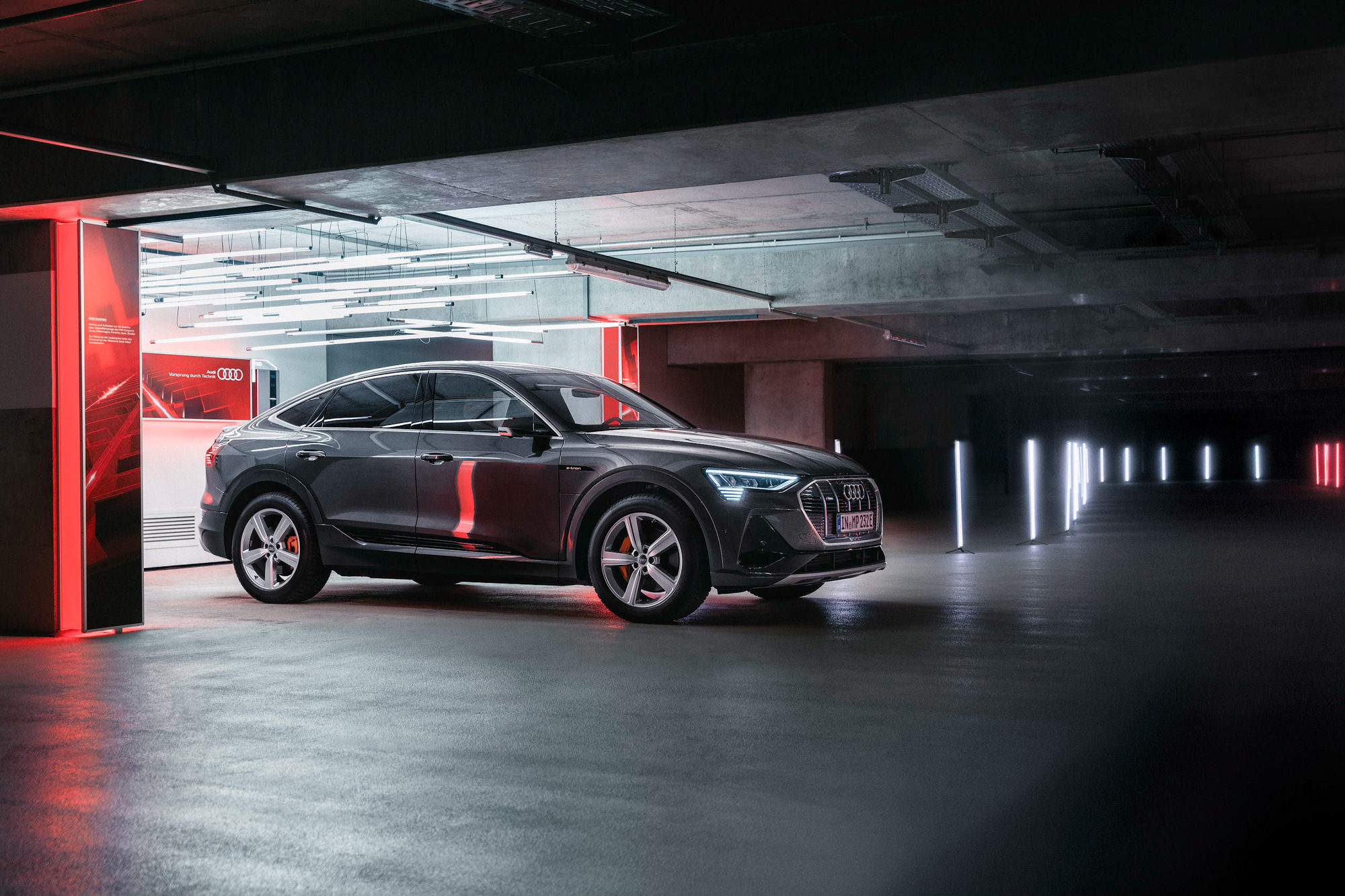 Audi e-tron driving through an underground parking garage for FC Bayern
