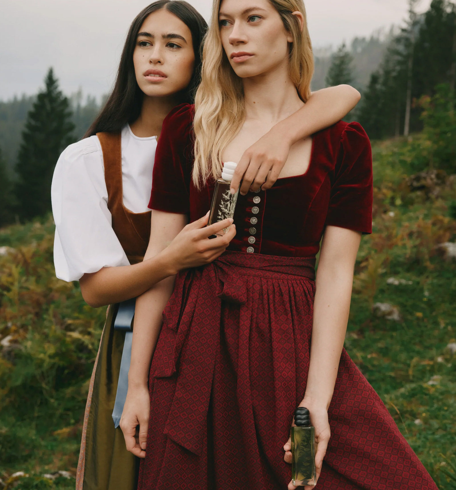 wwo female models in traditional dresses outdoors for Valée Alpura Fragrance 